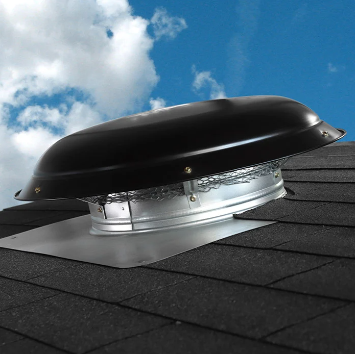A black roof vent with a blue sky in the background