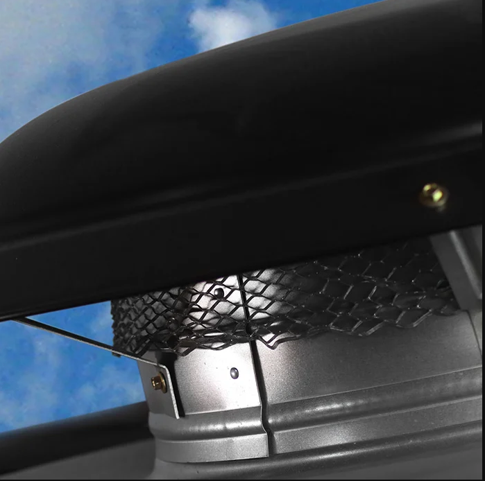 A close up of a chimney with a blue sky in the background