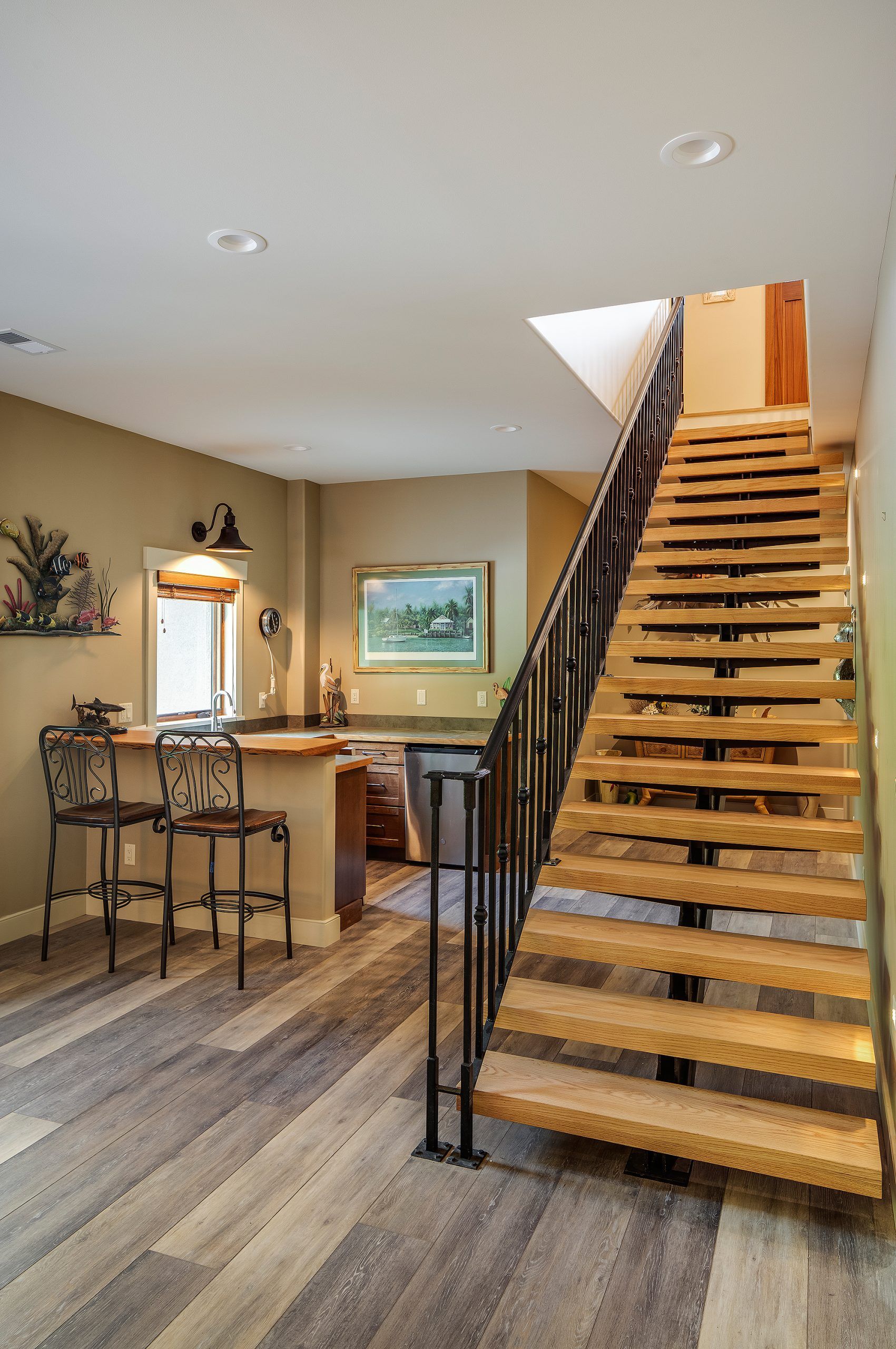 A wooden staircase leading up to the second floor of a house.