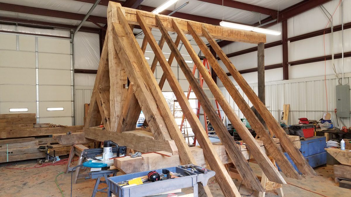 A large wooden structure is being built in a building.