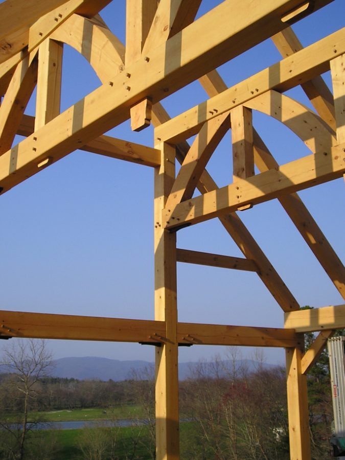 A wooden structure with a blue sky in the background.