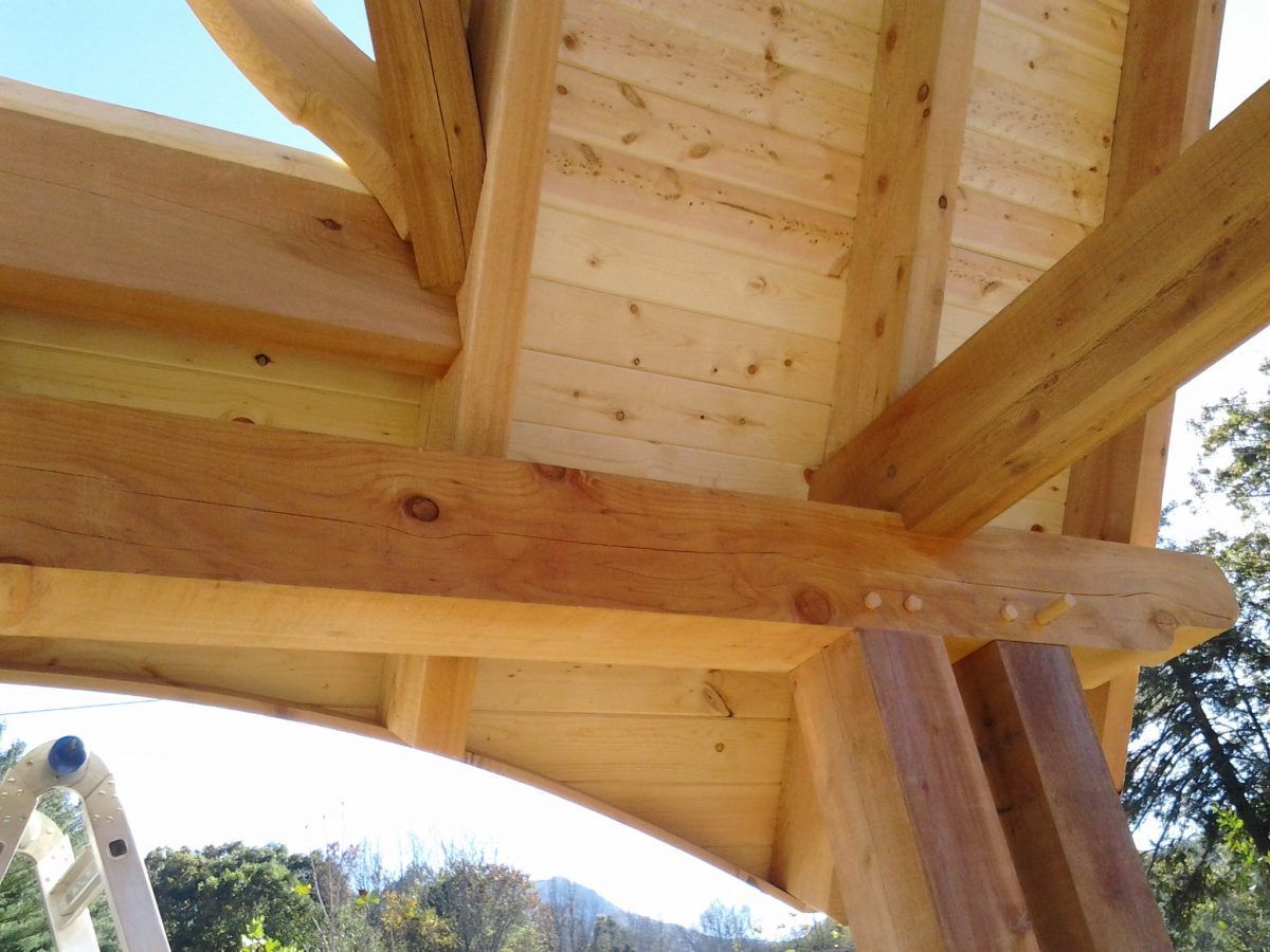 A wooden structure with a blue sky in the background.