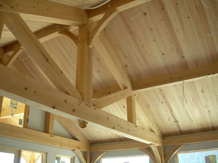 A wooden structure with a ceiling made of wood.