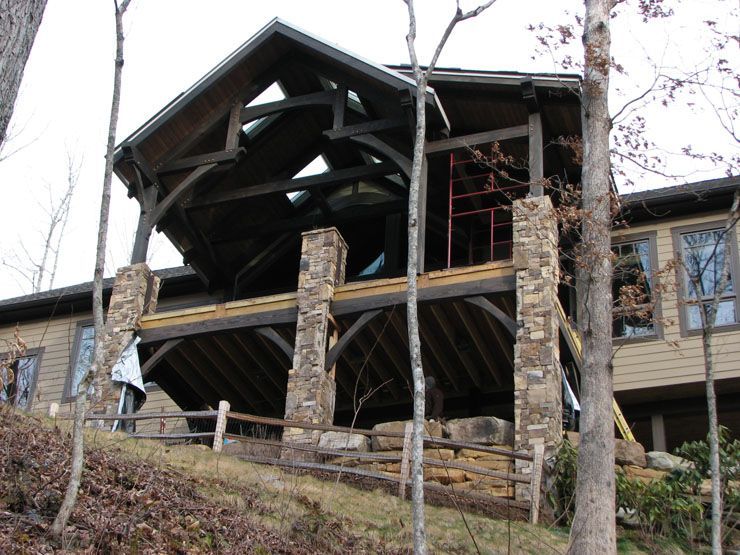 A house that is being built on top of a hill.
