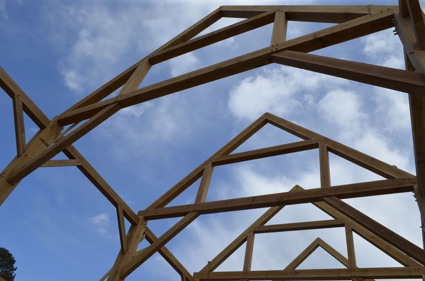 A wooden structure with a blue sky in the background.