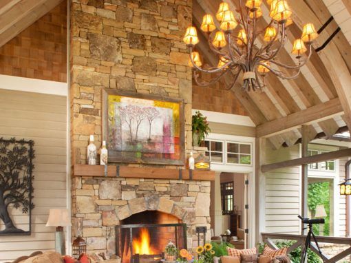 A living room with a fireplace and a chandelier