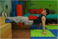 Boy doing physical therapy moves