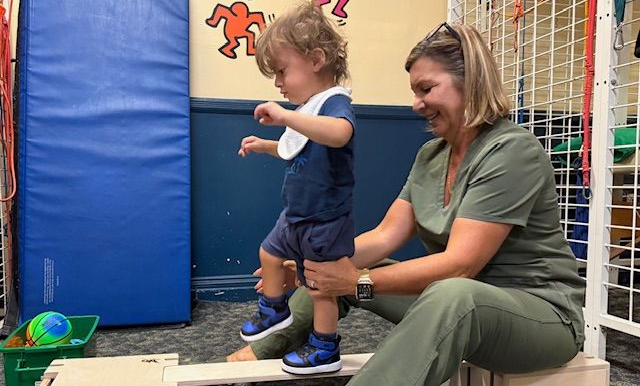 child walking on a board
