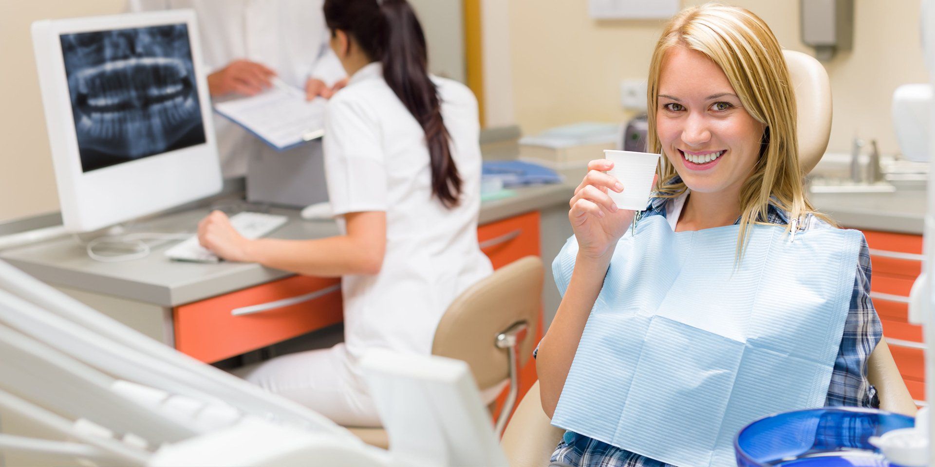 Happy woman in a dental clinic