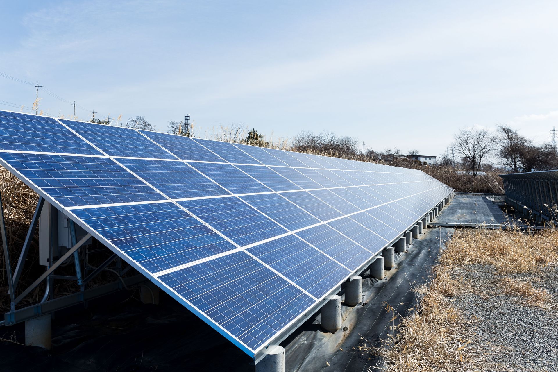 Solar panels off-grid systems installed in a field under a clear blue sky