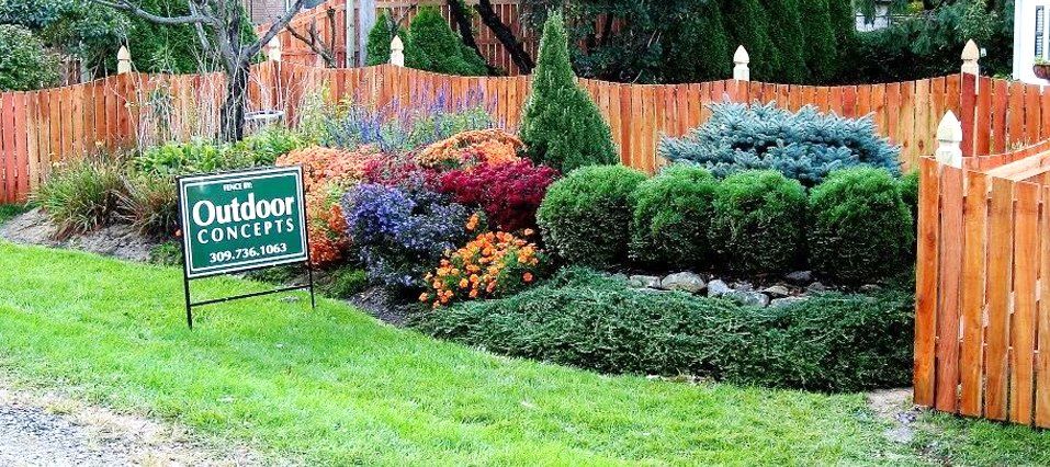 Wooden fence and a garden created by Outdoor Concepts