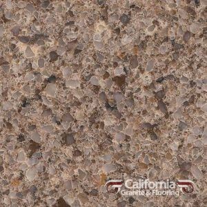 Close-up of brown speckled countertop surface with varying shades of tan and brown flecks.