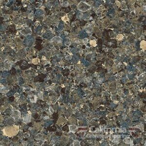 Close-up of granite countertop with blue, brown, and tan flecks.