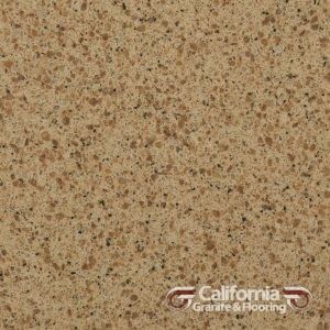 Tan quartz countertop with speckled pattern.