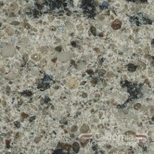 Close-up of a speckled light gray countertop with dark brown and blue flecks.
