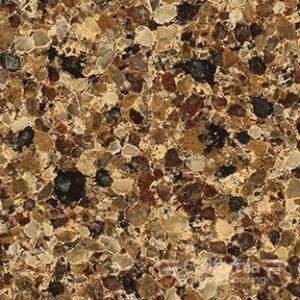 Close-up of speckled brown and beige countertop with dark spots throughout.