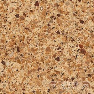 Close-up of a tan and brown speckled countertop with a textured surface.