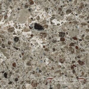 Close-up of speckled gray and brown stone with various sized aggregate.