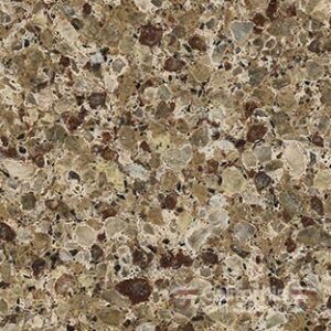 Close-up of a speckled countertop. It has a tan base with brown and gray flecks.