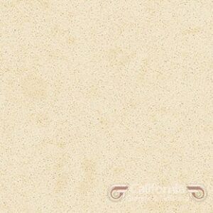 Cream-colored speckled quartz surface, likely countertop material, with subtle variations.