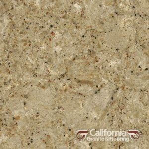 Close-up of beige and tan speckled granite countertop.