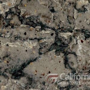 Close-up of granite countertop with gray, black, and brown veining and speckles.