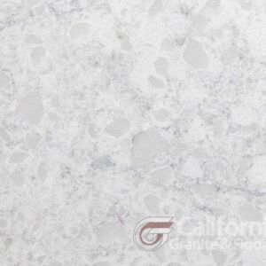 White quartz countertop with light gray veining and specks.