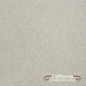 Off-white speckled quartz countertop with the California Granite & Flooring logo in the corner.