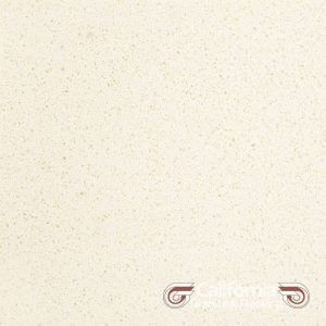 Beige speckled stone surface.