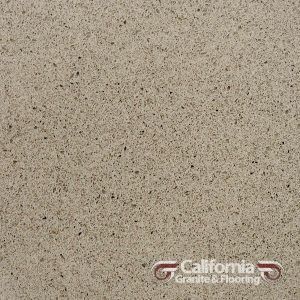 Tan speckled countertop with a California Granite & Flooring logo.