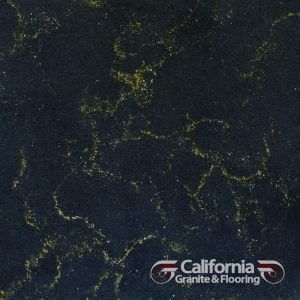 Dark stone surface with gold veining, California Granite & Flooring logo.