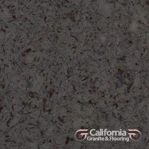 Dark gray countertop with mottled, reddish-brown flecks, California Granite & Flooring logo in corner.