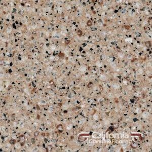 Close-up of a beige speckled countertop surface with black and gray flecks.
