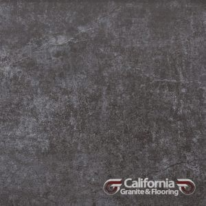 Dark gray tile with a worn, textured appearance. California Granite & Flooring logo at the bottom right.