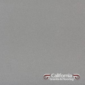 Gray-colored granite slab with a subtle textured surface, branded with the California Granite & Flooring logo.