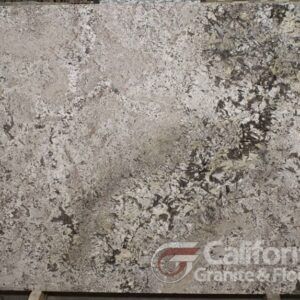 Granite slab with a cream, gray, and black mottled pattern; California Granite & Floors logo.