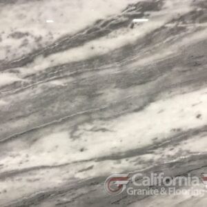 White and gray marble slab with flowing veining, likely for countertops or flooring.