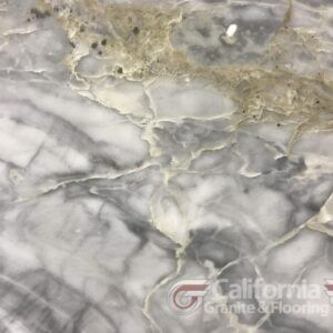 Gray and white marble countertop with gold veining.