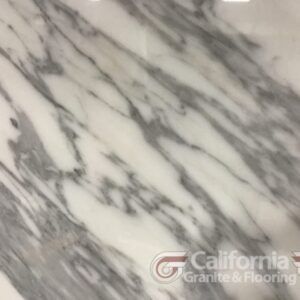 White marble slab with gray diagonal veining pattern.