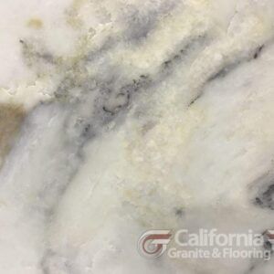 Close-up of white marble with gray and yellow veining.