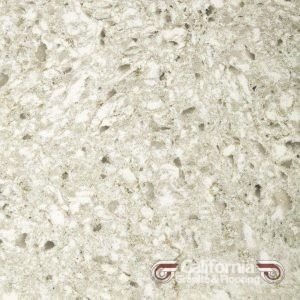 Close-up of light gray quartz countertop with speckled patterns, manufactured by California Granite & Stone.