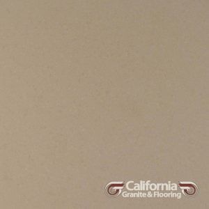 Tan solid-colored countertop surface. California Granite & Flooring logo in the bottom right.