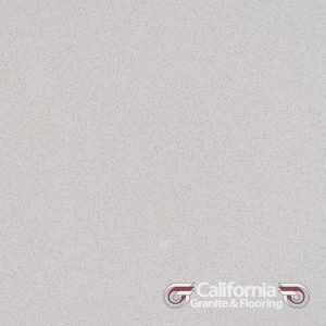 Light gray speckled quartz countertop with California Granite & Flooring logo.