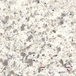 White countertop with speckled pattern of gray and black flecks.
