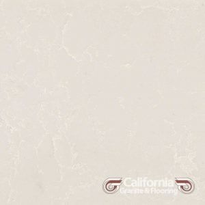 Cream-colored quartz countertop with subtle veining, the logo for California Granite & Flooring at the bottom right.
