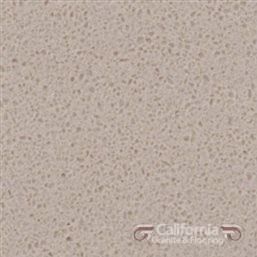 Beige quartz countertop with small flecks.