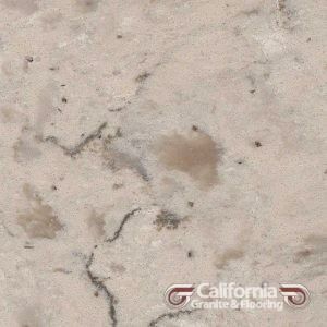 Beige granite with dark veins and brown specks, viewed up close.