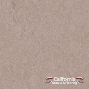 Tan-colored, textured stone tile, possibly granite, with the California Granite & Flooring logo in the corner.