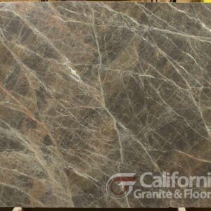 Dark brown marble slab with white veining, displayed at California Granite & Floor.