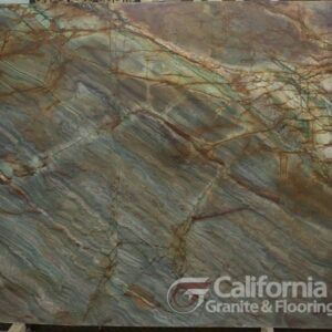 Large slab of blue, green, and brown marble with intricate veining patterns. California Granite & Flooring logo.
